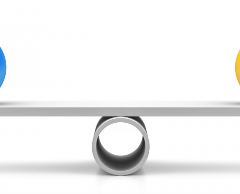 Seesaw with blue and yellow ball